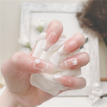 faux-ongles-french-blanc-transparent-carre-moyen-bordure-blanche-moderne-fleur-blanche-decor-manucure